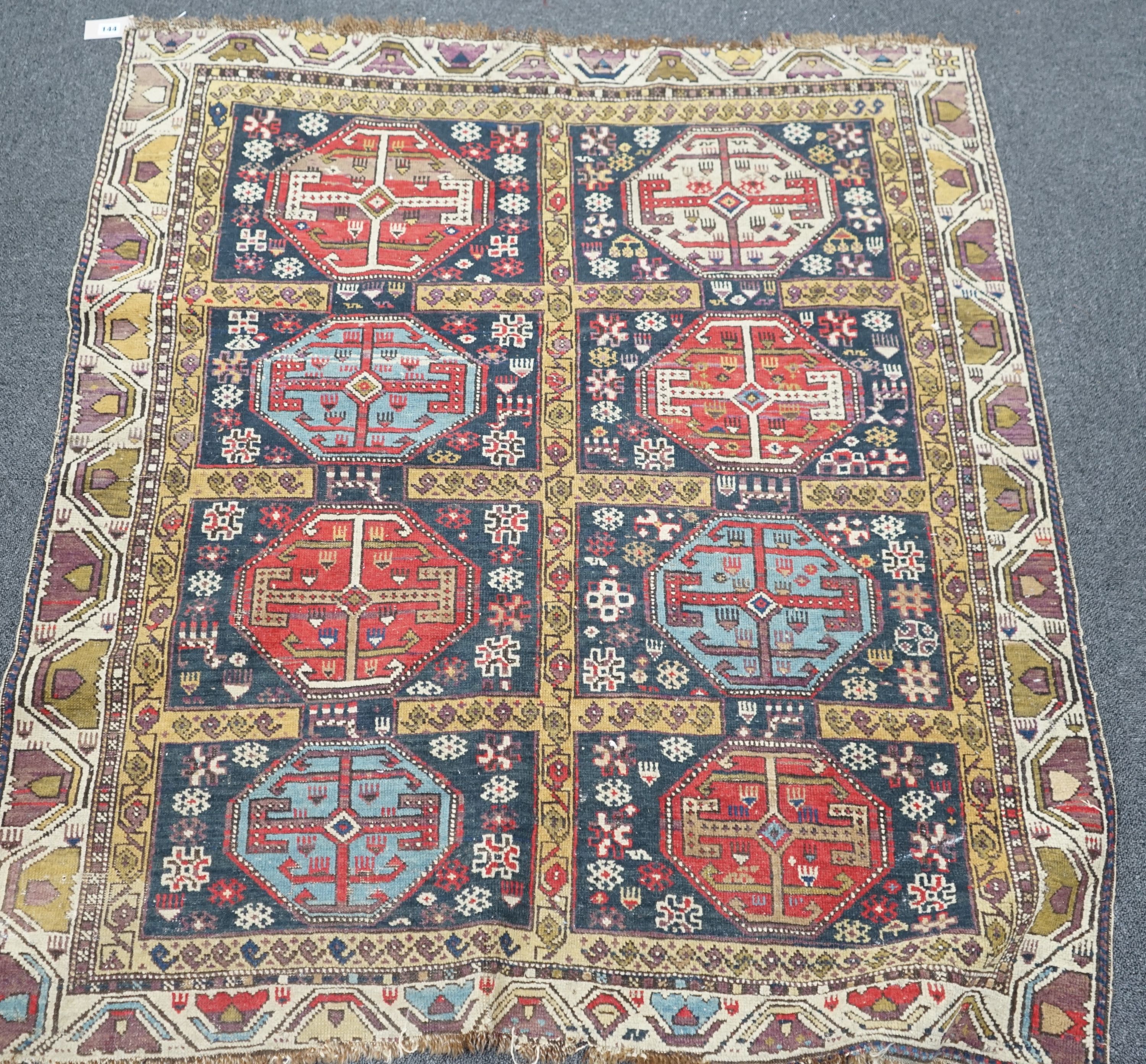 An antique Caucasian blue ground rug, 134 x 120cm